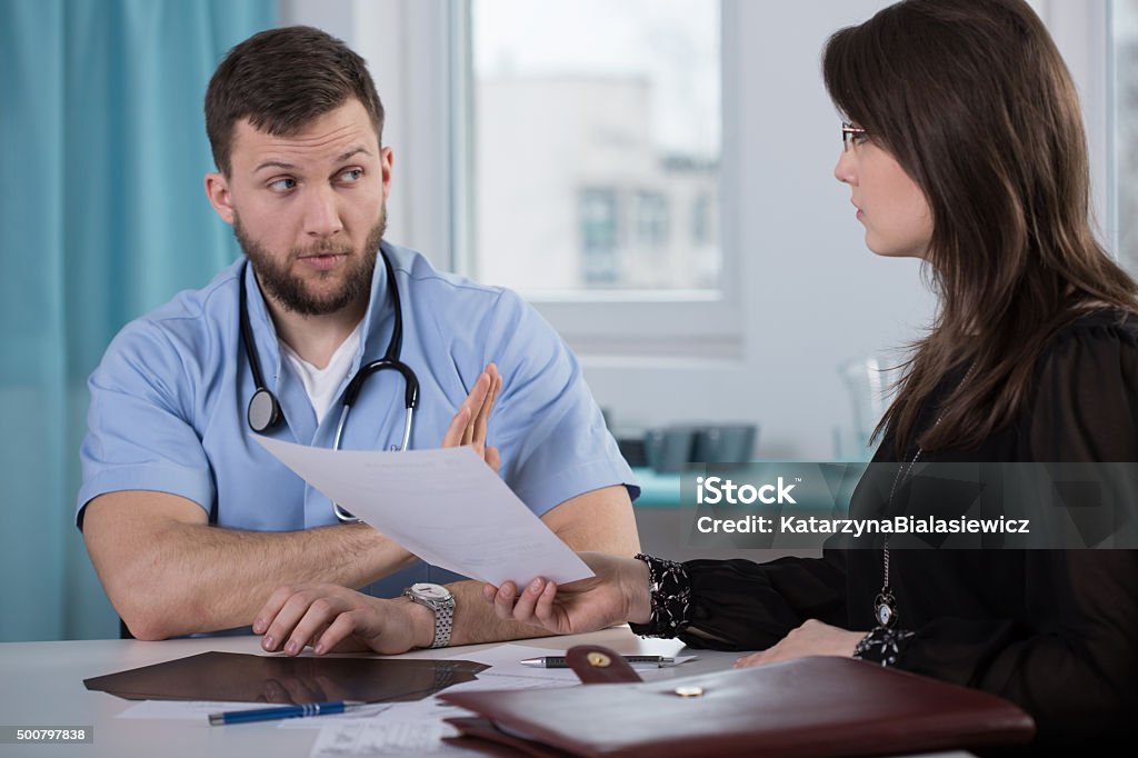 Lawyer of medical error victim Picture of guilty doctor and lawyer of medical error victim Doctor Stock Photo