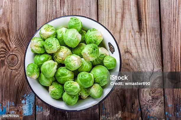 Fresh Organic Brussels Sprouts In A Bowl Stock Photo - Download Image Now - Brussels Sprout, 2015, Agriculture