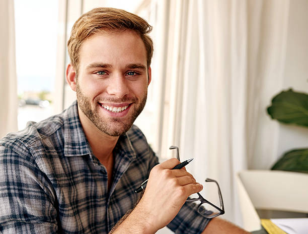 istock Young caucasian entrepreneur smiling at camera with glasses 500798888