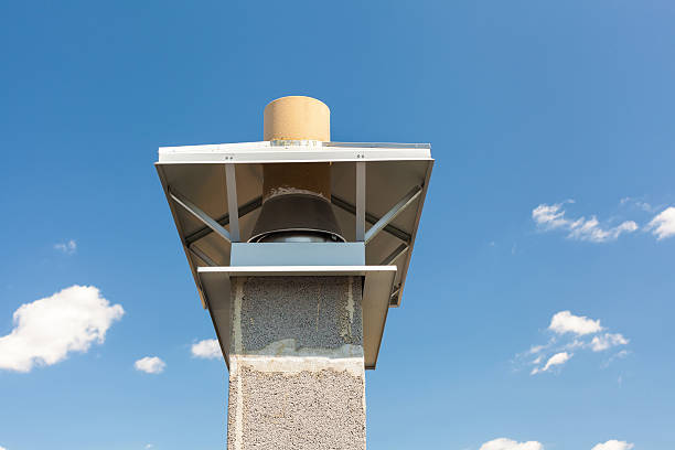 istock New chimney (smokestack) with metal box closeup 500799838