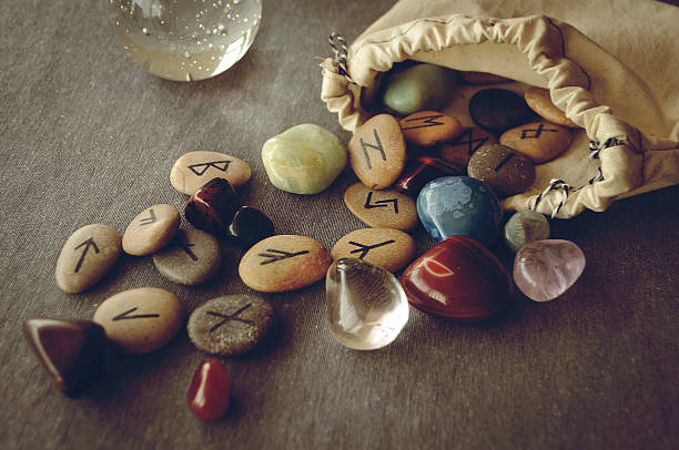runes and tarot cards divination and prediction on runes and Tarot, mysticism or esoteric isolated on grey background runes stock pictures, royalty-free photos & images