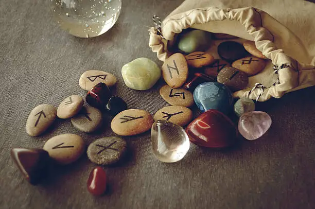 Photo of runes and tarot cards