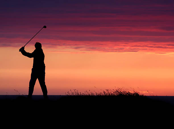 istock Golfer's final drive of the day in the sunset. 500801207