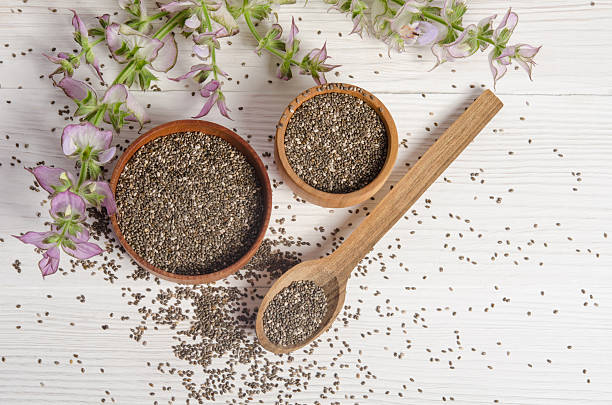 Chia seed healthy super food with flower over white stock photo
