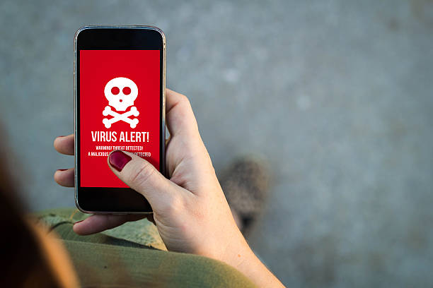 istock Woman walking smartphone virus 500803096