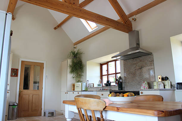 istock Country kitchen, granite worktop, gas range cooker, tiled floor, pine-table 500803593