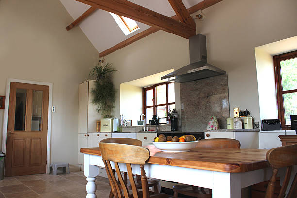 istock Country kitchen, granite worktop, gas range cooker, tiled floor, pine-table 500803603