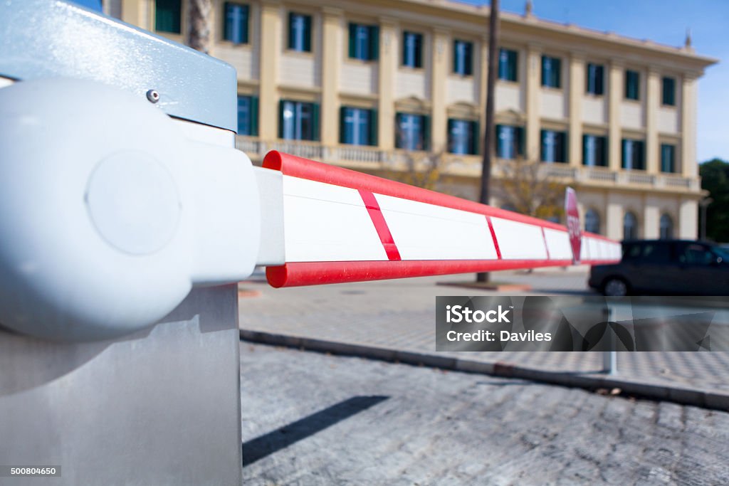 Vehicle access barrier. Close up view of parking bar in a parking entry, Parking Lot Stock Photo