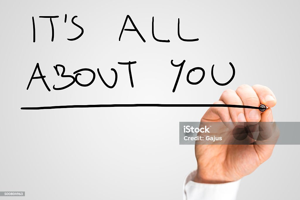 It's all about you Male hand writing phrase It's all about you on virtual screen. Care Stock Photo