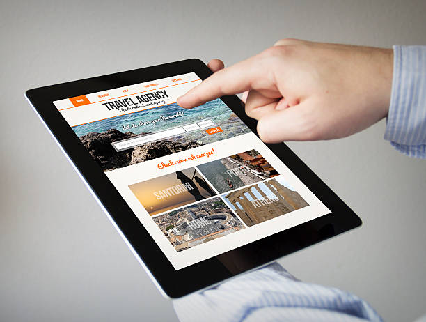 istock travel agency website on screen on a tablet 500805290