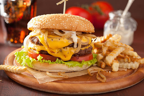 istock double cheeseburger with tomato and onion 500805456