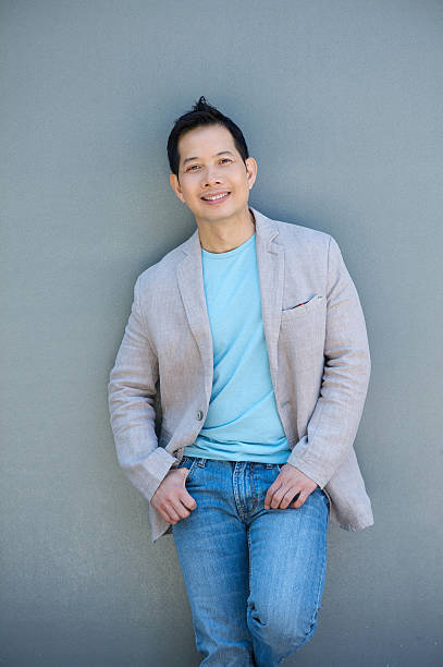 istock Cool asian man smiling outdoors 500806041