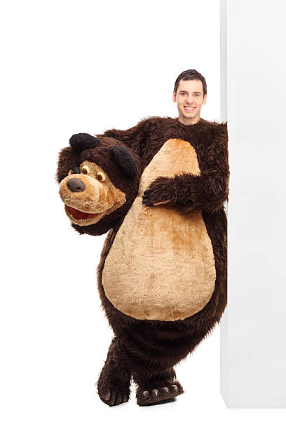istock Man in a bear costume leaning on a wall 500806896