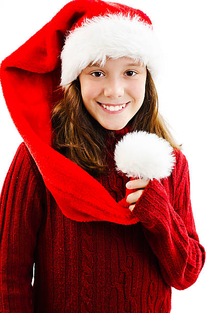 istock Young girl in red Santa hat. Isolated on white background 500807022