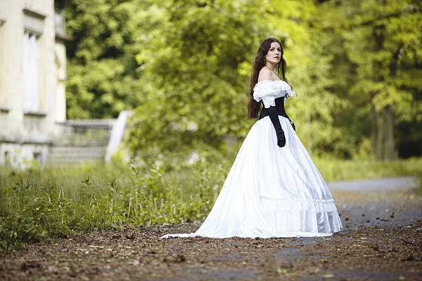istock Mysterious woman in a white Victorian dress 500807645