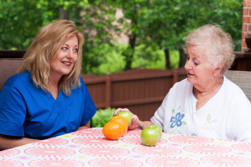 Stroke patient incorrectly matches apples to oranges during an aphasia rehabilitation home health speech therapy session that is targeting visual comprehension