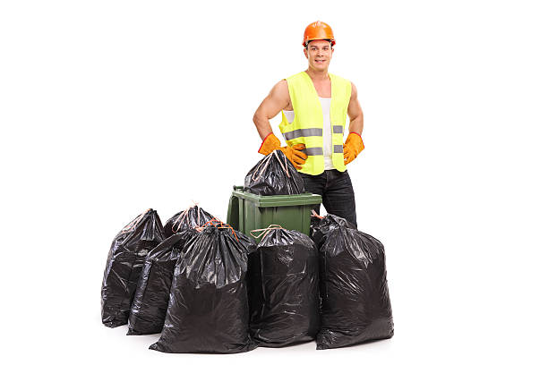 istock Waste collector posing behind trash bags 500809690