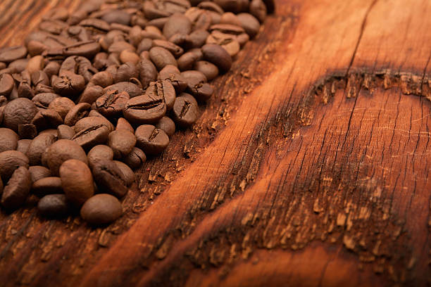 istock Coffee beans on old wooden background 500811606