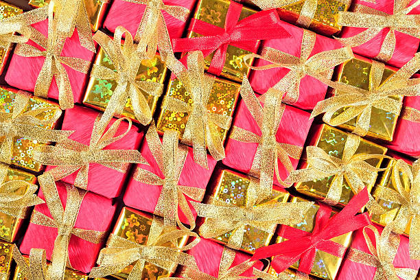 istock Golden and red gifts as background 500812420