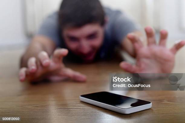 Man Creeping On Ground Smart Phone And Internet Addiction Concept Stock Photo - Download Image Now