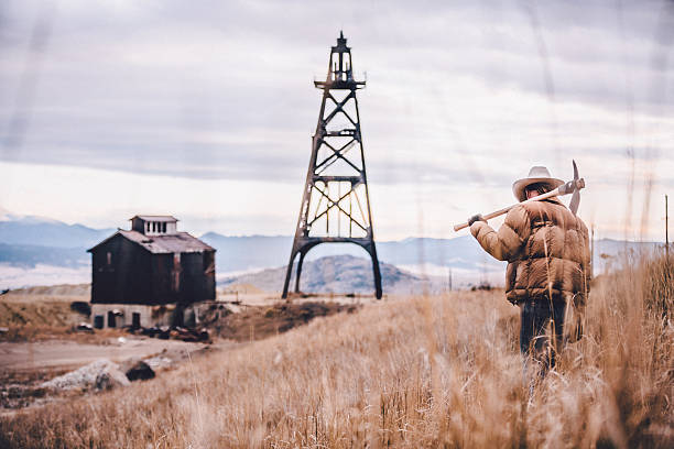 istock Hard working mountain man walks away in hay field 500828413