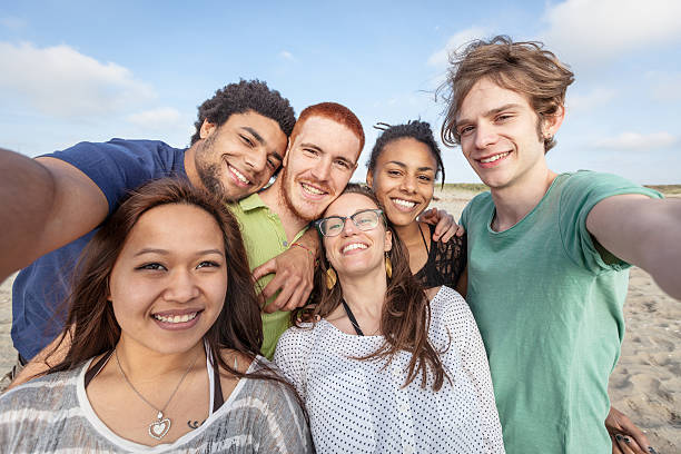 istock Multiracial Group of Friends Taking Selfie at Beach 500828607