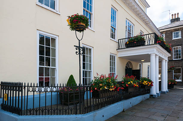 Front view of Athenaeum in Bury St Edmunds town centre Bury St Edmunds, United Kingdom - June 25, 2014: The Athenaeum is a wonderful recently refurbished Grade I listed building with a Georgian chandeliered ballroom bury st edmunds stock pictures, royalty-free photos & images