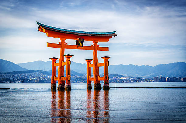 The Great Torii of Itsukushima shrine MIYAJIMA,JAPAN - April 7,2014 : The great Torii is the boundary between the spirit and the human worlds. honshu stock pictures, royalty-free photos & images