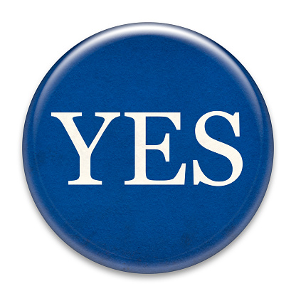 Grungy Yes badge (campaign button) isolated on white.