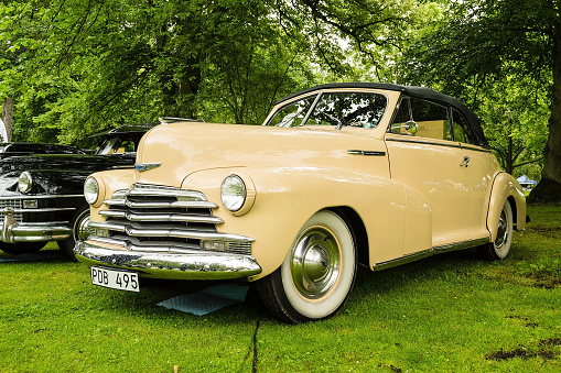 Ronneby, Sweden - June 28, 2014: Nostalgia Festival with classic cars and motorcycles as main attractions. Yellow Chevrolet convertible 1948.