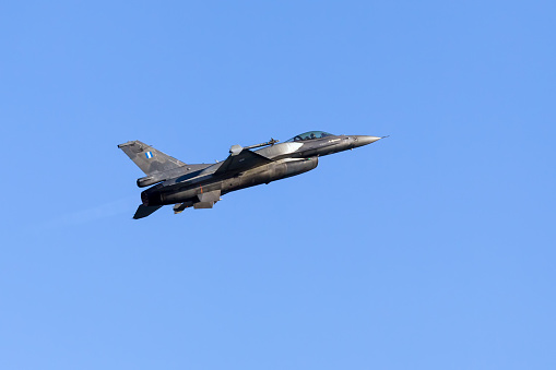 Kavala, Greece - June 21, 2014: HAF F-16 flying in the sky during the Kavala Airshow 2014, in Kavala, Greece. The Municipality of Kavala, as head of the Organizing Committee, is planning its fourth consecutive international air and naval organization «4th Kavala AirSea Show 2014», on 20,21 and 22 June in the coastal zone of the port of our city and the surrounding area.