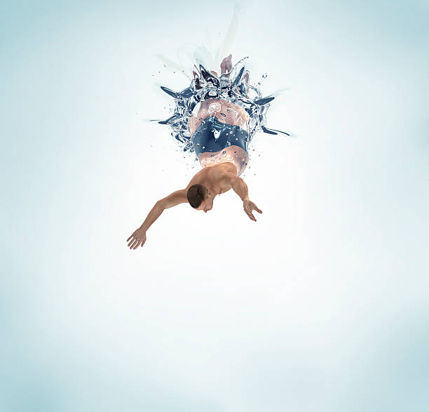 istock man diving into water isolated on white 500833192
