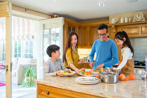 istock Family Cooking Dinner Together 500833602