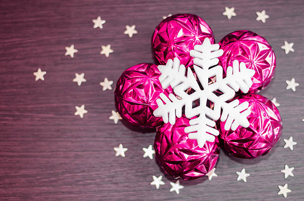 White, magenta and gold christmas ornaments on blurred background with space for text. Merry christmas card. Winter holidays. Xmas.