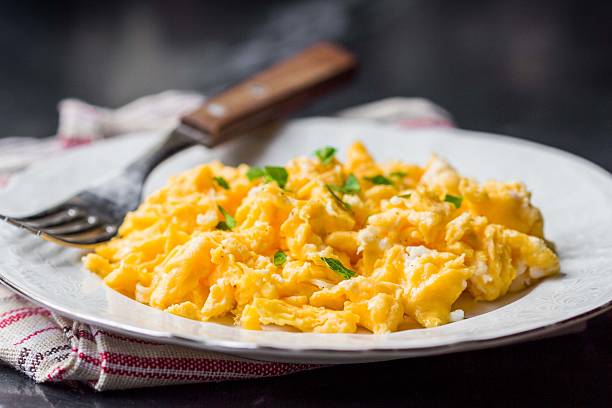 Scrambled eggs, omelets, delicious morning breakfast stock photo