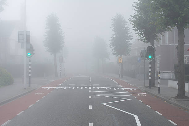 istock Green light and fog on intersection in small rural town 500837796
