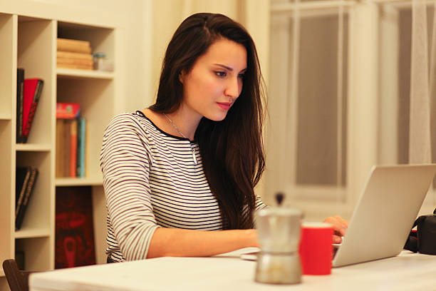 istock Young brunette working on the laptop 500840892