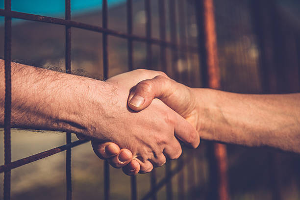 women and men shaking hands
