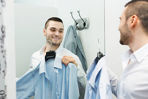istock Guy trying on new shirt 500845146