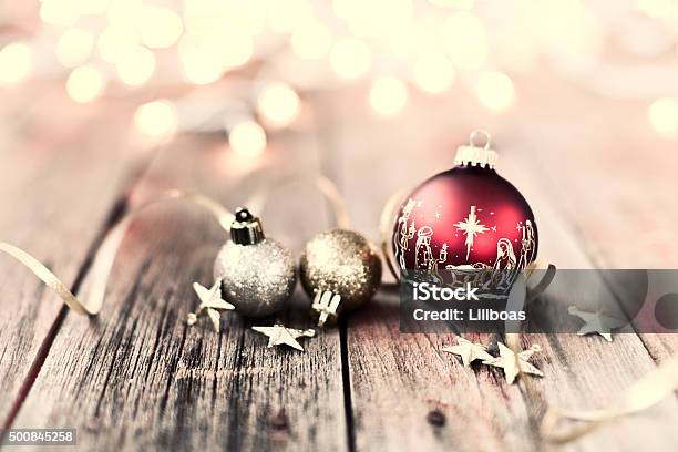 Nativity Christmas Ornaments With Decorations And Ribbon On Wood Background Stock Photo - Download Image Now