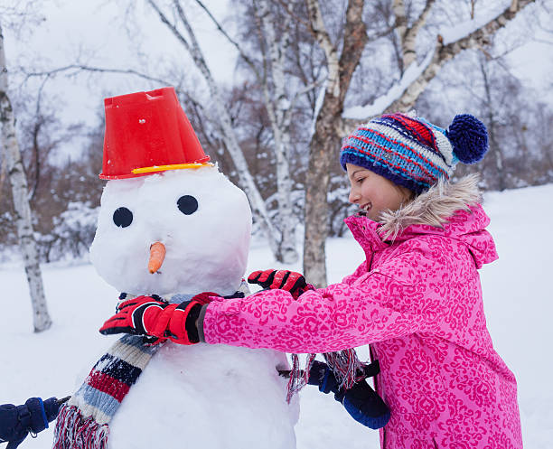 istock Girl plaing in the snow 500845590