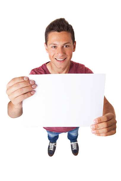 istock teen with blank white paper 500846145