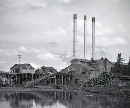 This is the Brooks-Scanlon lumber mill in Bend, Oregon about 1977. It shows the log pond and iconic three smokestacks that still survive today.