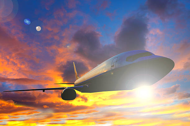 istock airplane silhouette flying over sky at sunset or sunrise background 500848181