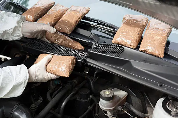 Drug smuggled in a car's engine compartment