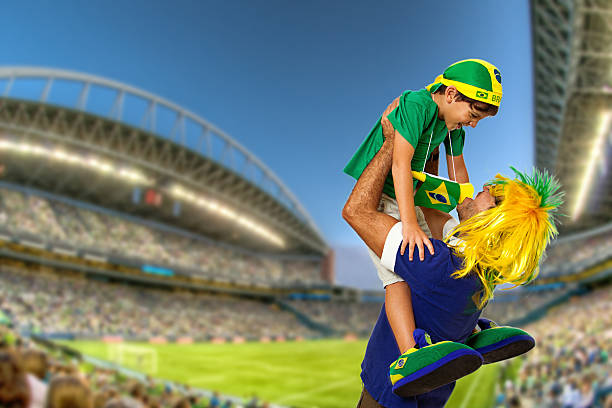 tifoso brasiliano urlare al stadium - arms raised green jumping hand raised foto e immagini stock