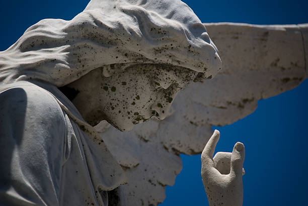 istock Angel figure in a cemetry by the ocean 500852069