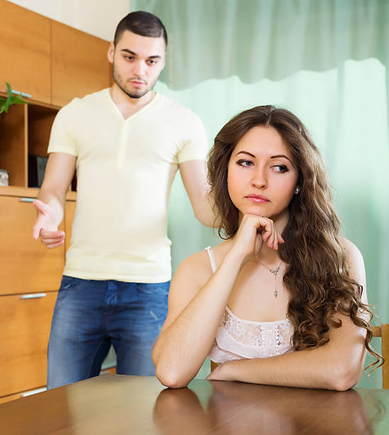 istock couple having serious talking in living room 500853427
