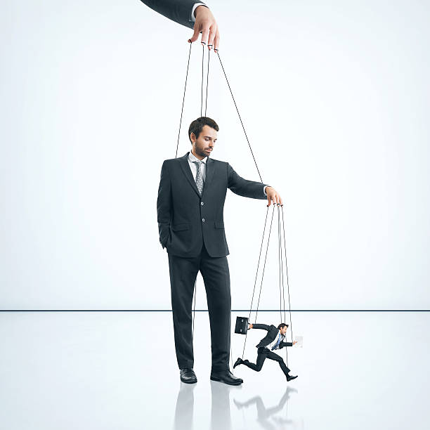 istock Businessman with marionette 500868837