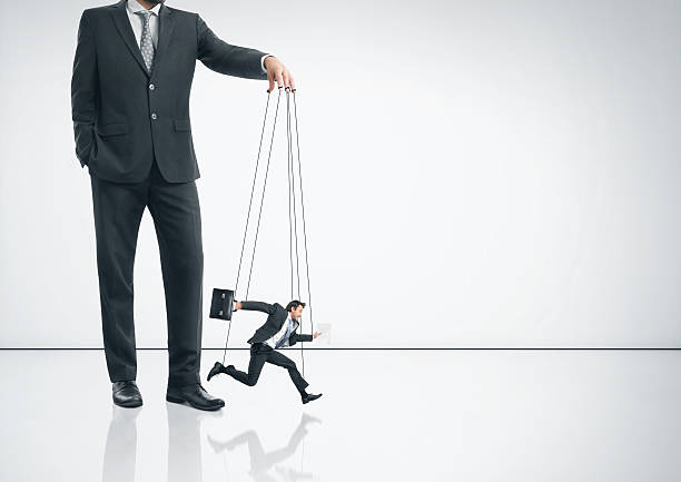istock Businessman with marionette 500868839